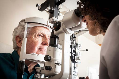 Senior man having an eye exam