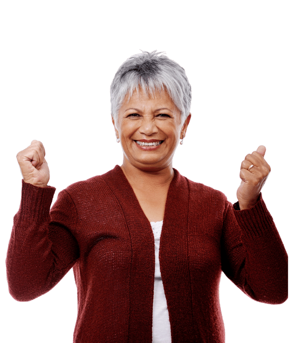 Senior woman in a maroon sweater raising her arms in a cheer